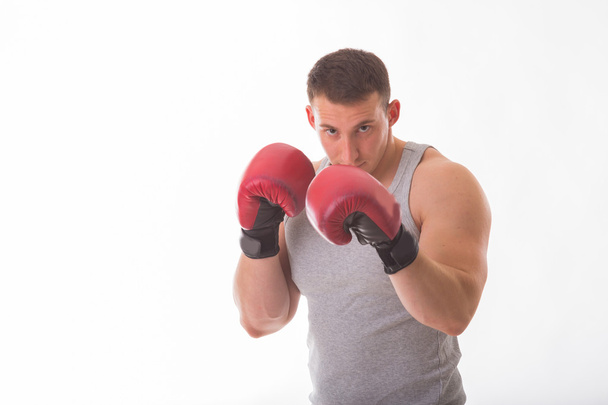 Strong man in red boxing gloves - Foto, Imagen