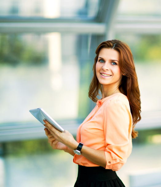 Young smiling business woman holding digital tablet computer - Photo, image