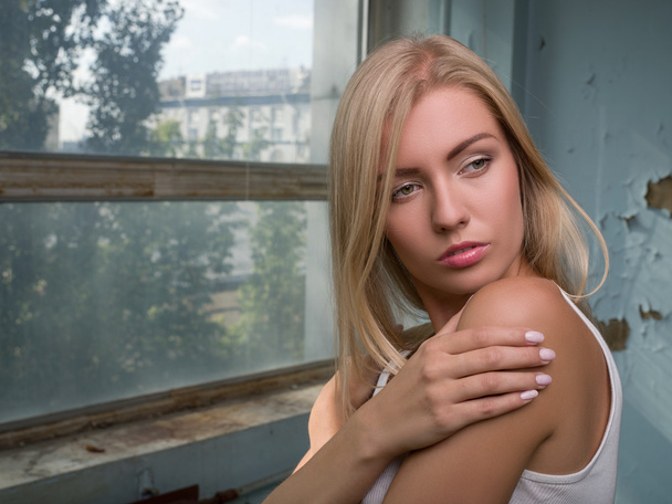 Beautiful blond girl expresses different emotions - 写真・画像
