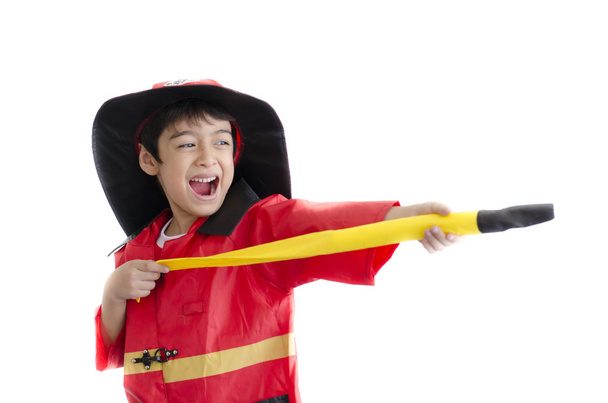 Little boy pretend as a fire fighter on white background - Photo, Image