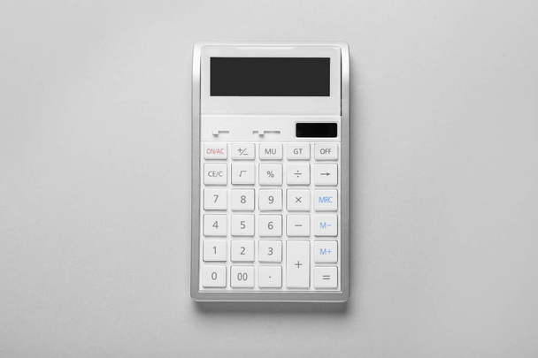 White calculator on light background, top view - Фото, изображение