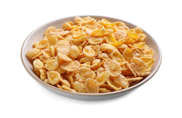 Bowl of tasty crispy corn flakes isolated on white - Photo, Image