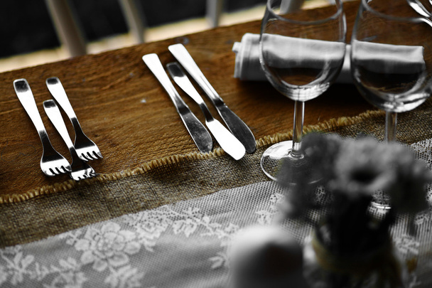Forks and knives on a table - Photo, Image