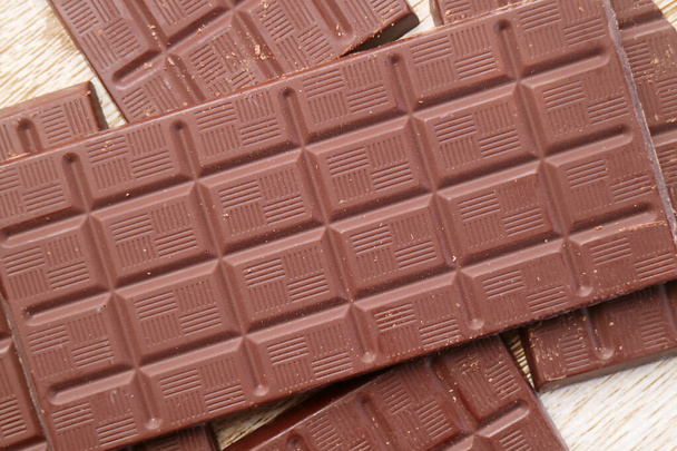 Top view of pile of delectable dark chocolate bars - Фото, зображення