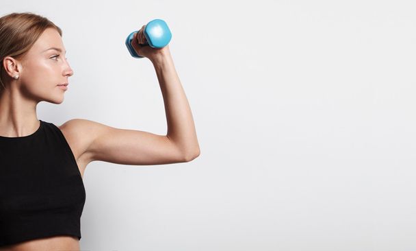 Woman holding barbell - Photo, Image