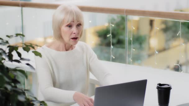 Mature businesswoman typing on laptop losing online gambling game losing bid in internet auction worried woman fails feels stressed because of negative outcome low grade result worries about bad news - Video