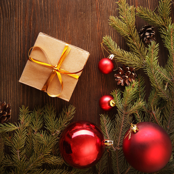 Christmas tree with gift box and decorations on wooden backgroun - Valokuva, kuva