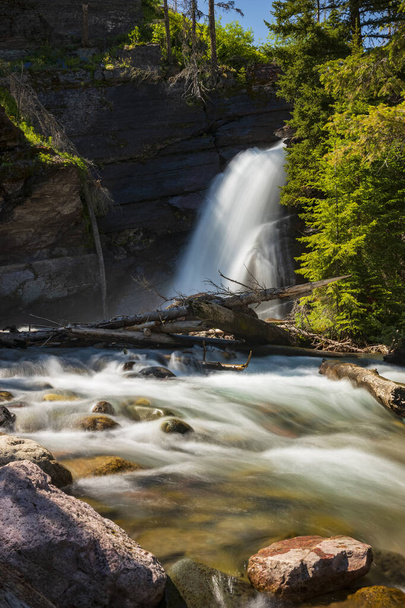 Baring Falls, photographed in motion-blur, is a waterfall located along the same trail as St. Mary and Virginia falls in Glacier National Park, Montana.  - Foto, Bild