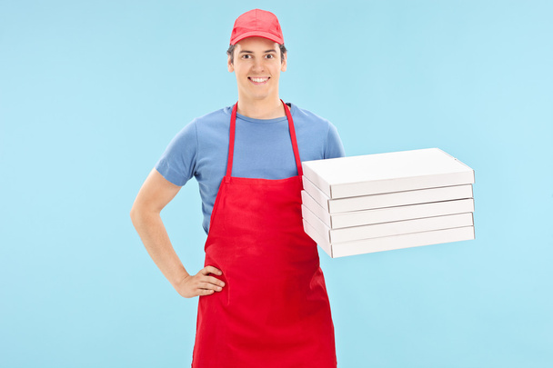 Pizza chef sosteniendo montón de cajas
 - Foto, Imagen