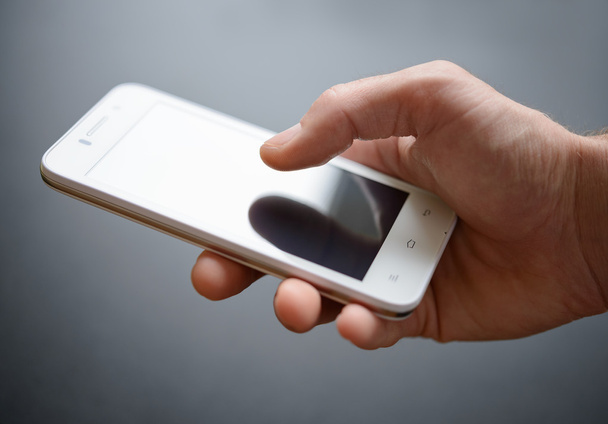 White Smart Phone in the Hand - Zdjęcie, obraz