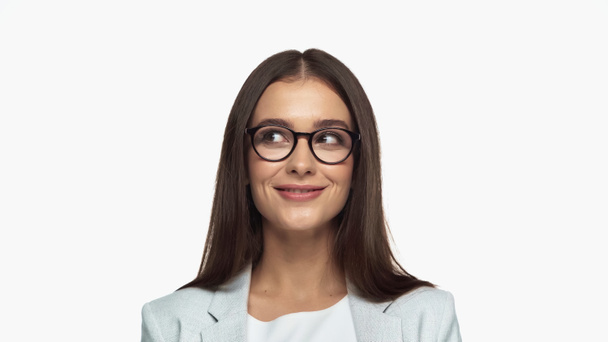 successful businesswoman in grey blazer and eyeglasses smiling isolated on white - Photo, image
