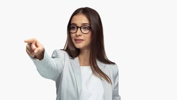 successful businesswoman in grey jacket and eyeglasses pointing with finger isolated on white - Фото, изображение