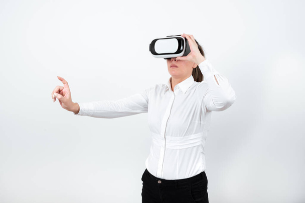 Woman Wearing Vr Glasses And Pointing On Important Message With One Finger. - Foto, imagen