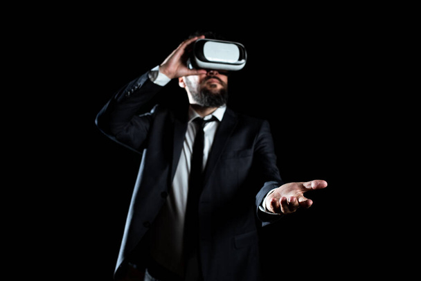 Businessman Wearing Suit Gesturing And Wearing Virtual Reality Simulator. - Photo, Image
