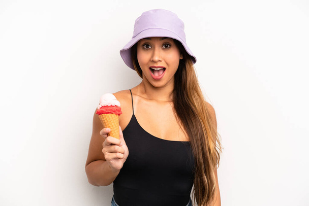 asian young woman looking very shocked or surprised. summer and ice cream concept - Фото, изображение