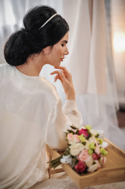 beautiful bride with long hair in white dress posing in studio - Foto, Imagem