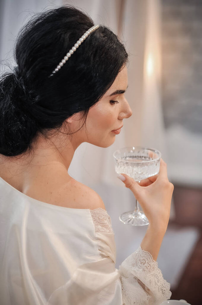 beautiful bride with glass of champagne - Фото, изображение