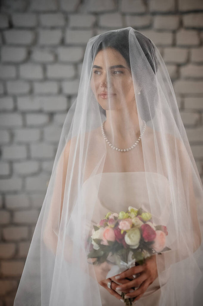 beautiful bride with veil and wedding dress - Photo, image