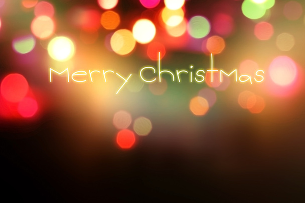 Frohe Weihnachten auf Bokeh-Hintergrund geschrieben - Foto, Bild