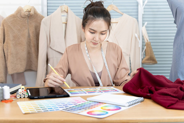 Professional designers are choosing color schemes to design blouses and dresses, Fashion designer, Creativity and ideas, Mannequin, Shirt sketch, Color scheme, Garment accessories ,work independently. - Photo, image