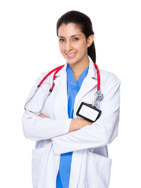 Naislääkäri, jolla kädet ristissä
 - Valokuva, kuva