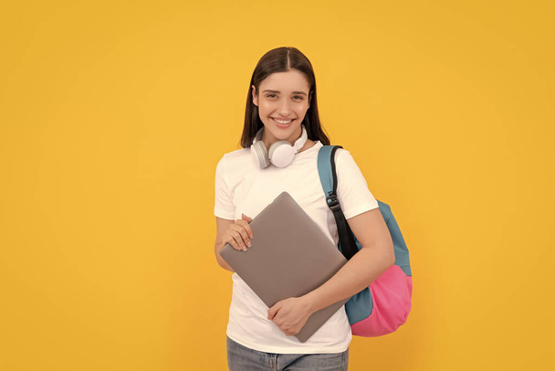 back to school. influencer blogging. glad girl with backpack and headphones. webinar for modern education. communication technology. woman with school bag hold laptop. buy online. - Photo, Image