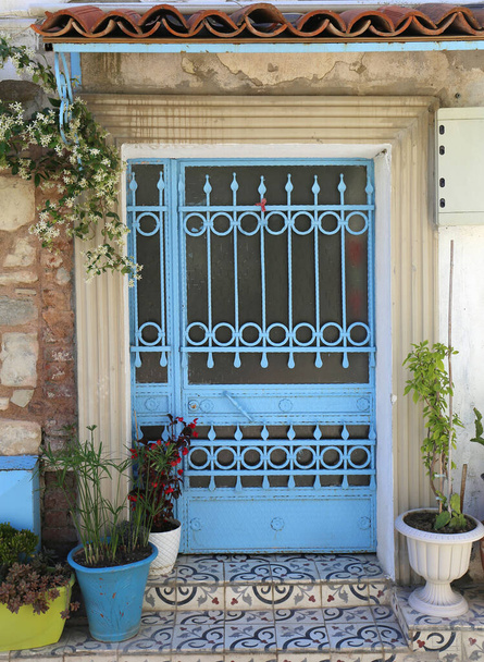 Greek Home with Metal Door and Flowers in Urla, Turkey - Foto, immagini