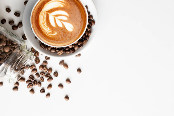 cup of coffee and bean on white table background. top view - Photo, Image