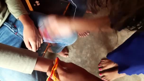 Sister tying rakhi to her brother. This festival celebrated across India as selfless love or relationship between brother and sister. Indian festival Raksha Bandhan. Indian culture. - Materiał filmowy, wideo