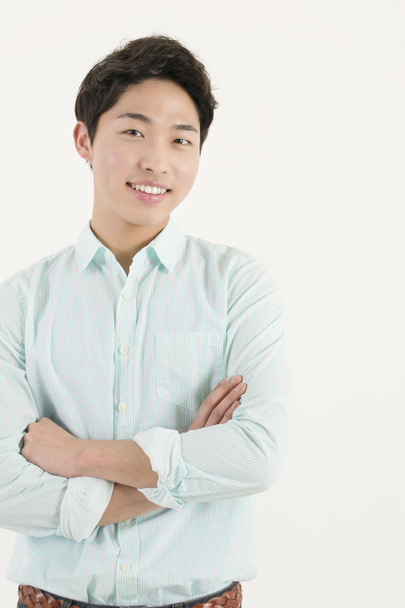 Asiático guapo macho estudiante con su brazos cruzados
 - Foto, Imagen