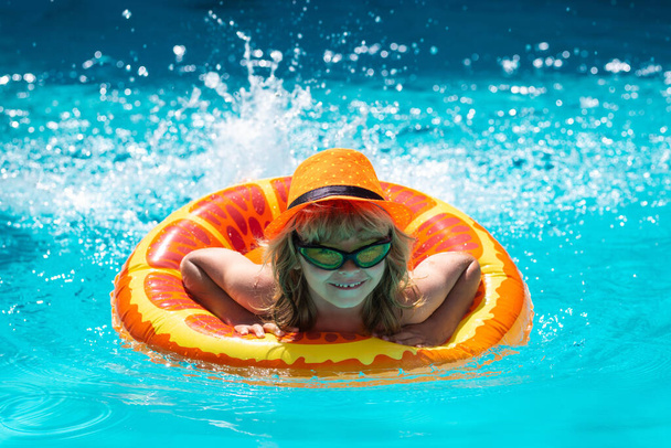 Kids swim swimming pool. Summer vacation concept. Summer kids portrait in sea water on beach. Blue water poolside - Φωτογραφία, εικόνα