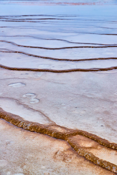 Image of Water trickles over small terraces in Yellowstone by spring - Foto, Imagem