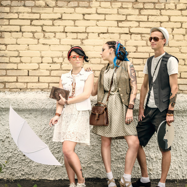young active guy and girls hipsters have good time outdoors - 写真・画像
