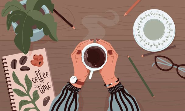 Female hands holding mug of coffee on wooden table background with sketchbook, plate, glasses, pencils, green plant. Autumn cozy mood vector flat cartoon design. Top view. - Vecteur, image