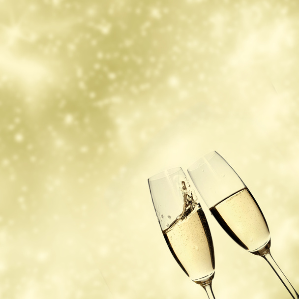 Toasting with champagne glasses on sparkling holiday background - Photo, Image