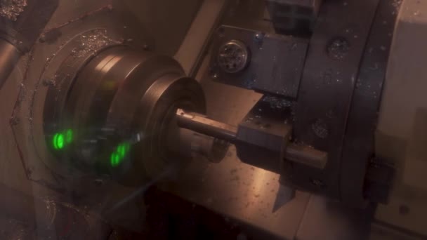 CNC milling machine at work. Cutting tool processing steel metal detail on turning cnc lathe machine in workshop - Materiał filmowy, wideo