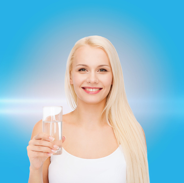 young smiling woman with glass of water - Foto, Imagem