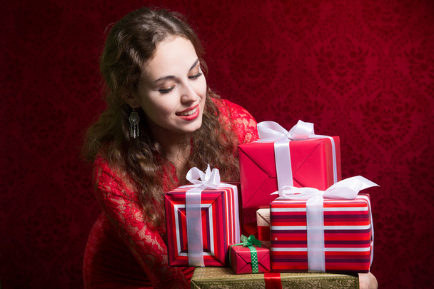 Beautiful girl looking at gifts. - Foto, Imagem