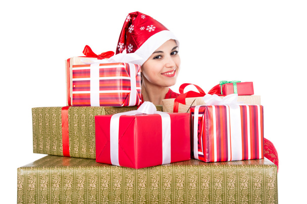 Beautiful christmas woman is holding gift in studio - 写真・画像