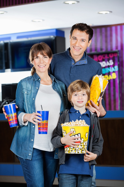 Family Holding Popcorns And Drinks At Cinema - Fotoğraf, Görsel