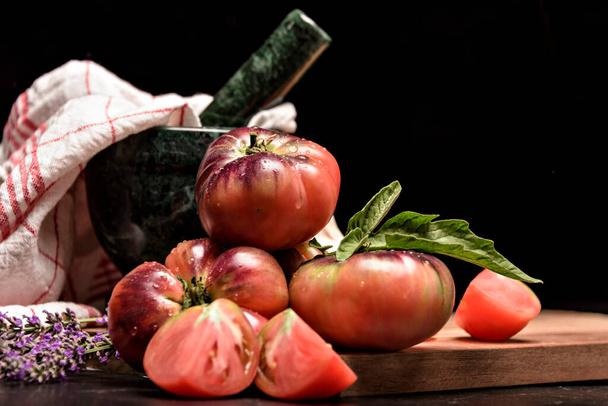 Still life with tiger tomato on wood table - Foto, Imagem