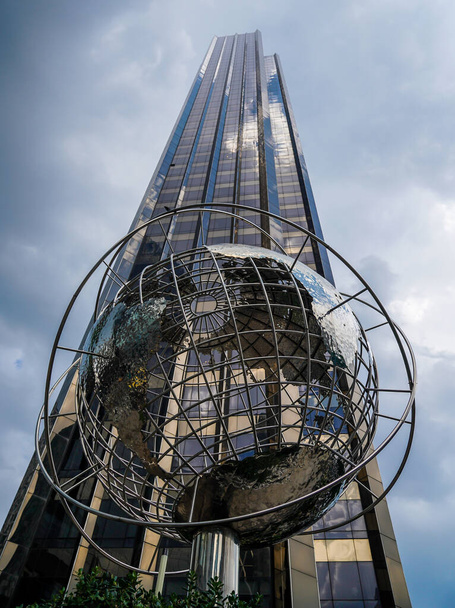 NEW YORK - JULY 21, 2022: Globe in the front of Trump International Hotel and Tower at Columbus Circle, Manhattan, New York - Фото, изображение