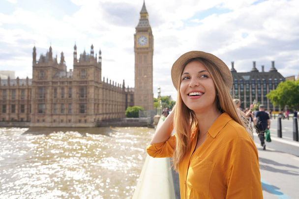 Smiling female tourist visiting London sights, United Kingdom - Photo, image