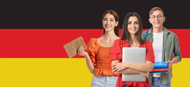 Portrait of students against flag of Germany - 写真・画像