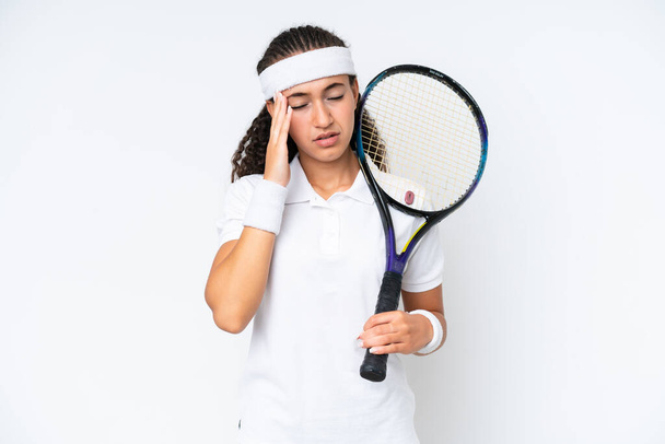 Young tennis player woman isolated on white background with headache - Fotografie, Obrázek
