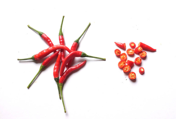 Ripe red hot chili peppers cut into pieces vegetable isolated on white background.cooking ingredients - Photo, Image