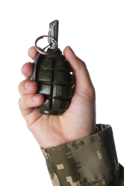 Soldier holding hand grenade on white background, closeup - Zdjęcie, obraz