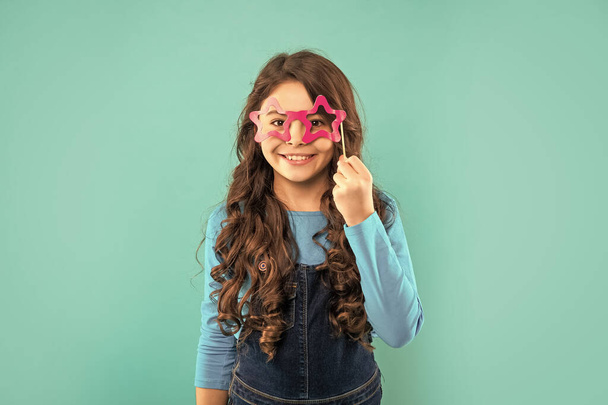 smiling teen party-goer. party time. birthday holiday celebration. having fun. lets celebrate. kid with long curly hair on blue background. funny child with glasses. - Foto, immagini