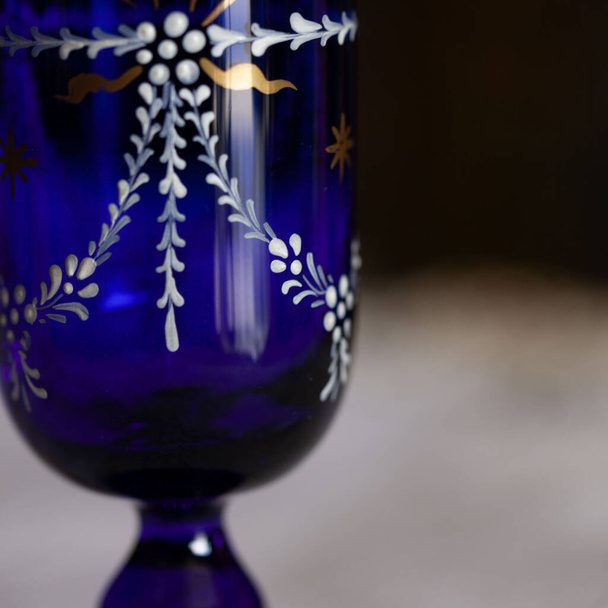 antique glass decanter in blue color in a luxurious interior. blue glass close-up - Foto, Imagen