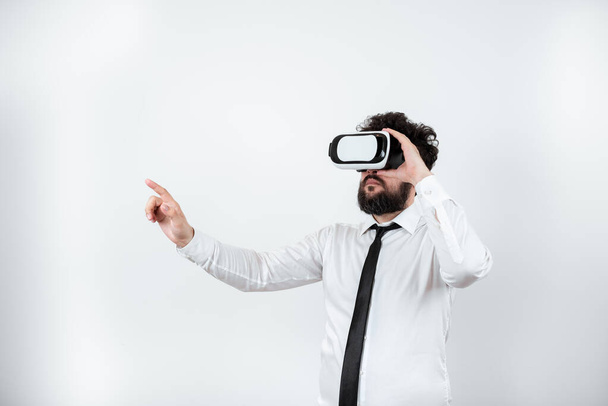 Man Wearing Vr Glasses And Pointing On Important Messages With One Finger. - Photo, Image